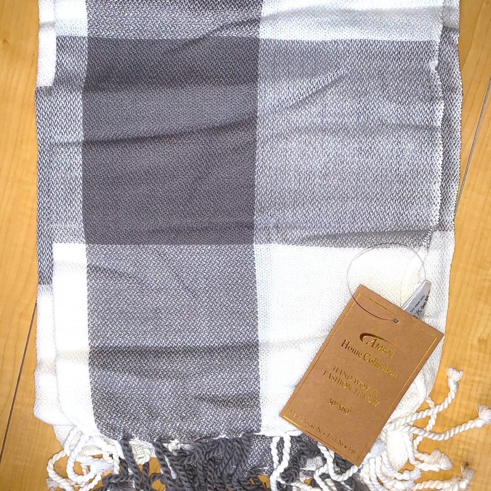 Brownish gray and white plaid throw